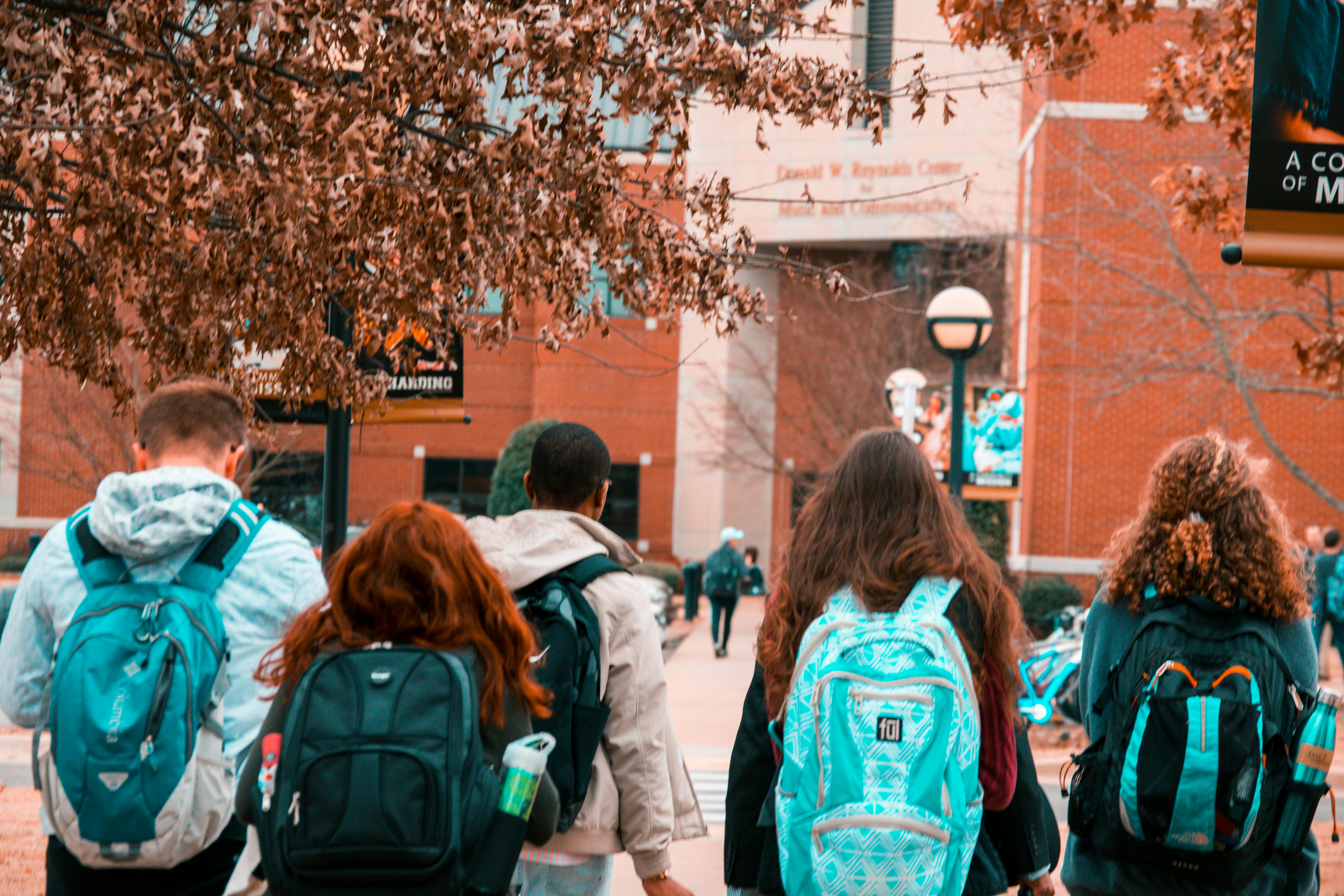 Students with backpacks walking together